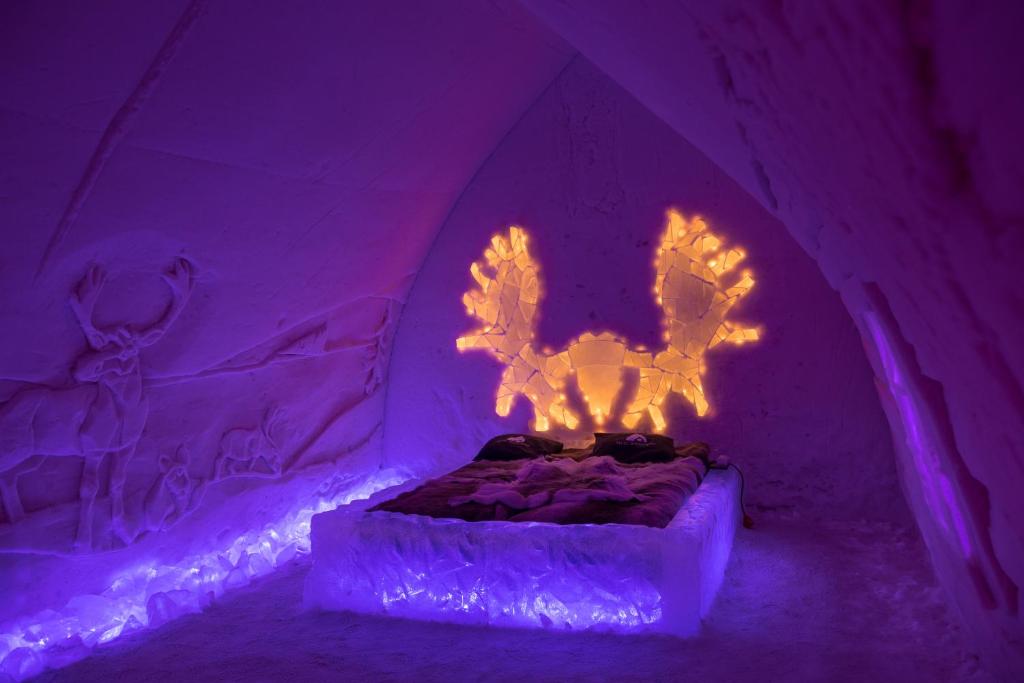 stay in an ice hotel in Lapland, Finland